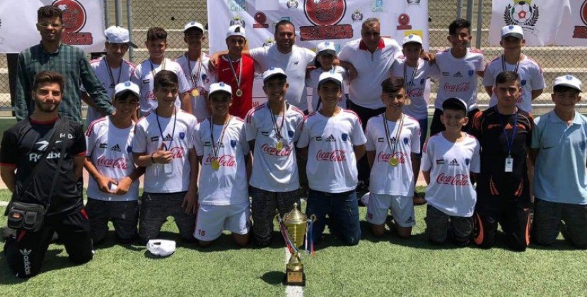 المشروبات الوطنية تقدم الزيّ الرياضي لفريق أكاديمية باريس سان جيرمان الفلسطينية