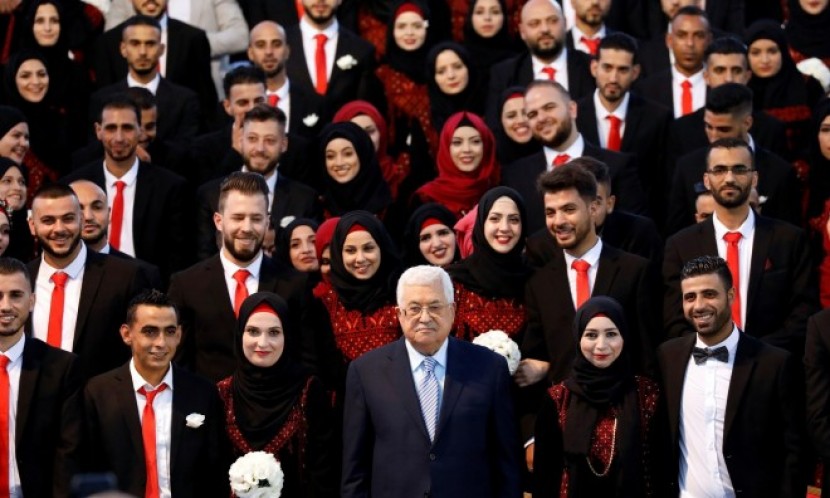 برعاية وحضور الرئيس عباس... عرس جماعي لأبناء الأجهزة الأمنية